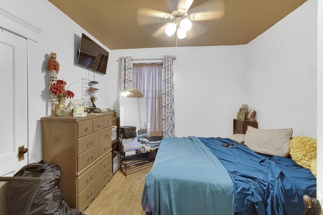 bedroom featuring a ceiling fan and light wood-type flooring