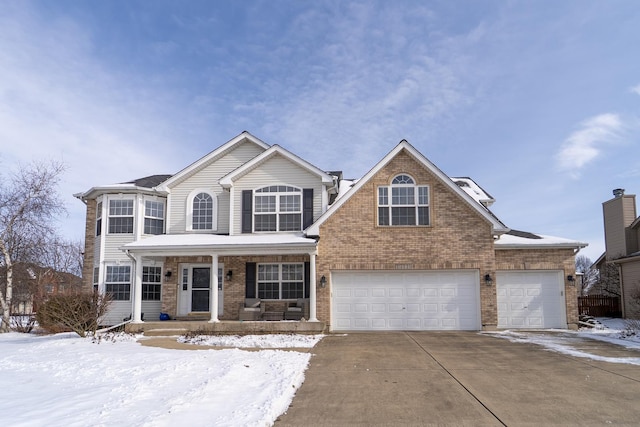 traditional-style home with a garage, covered porch, concrete driveway, and brick siding