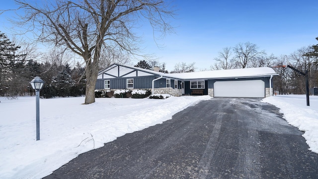 single story home featuring a garage