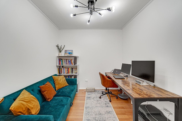 home office featuring hardwood / wood-style floors, a notable chandelier, and ornamental molding