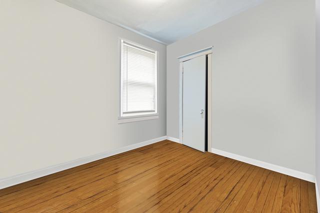 empty room featuring wood-type flooring