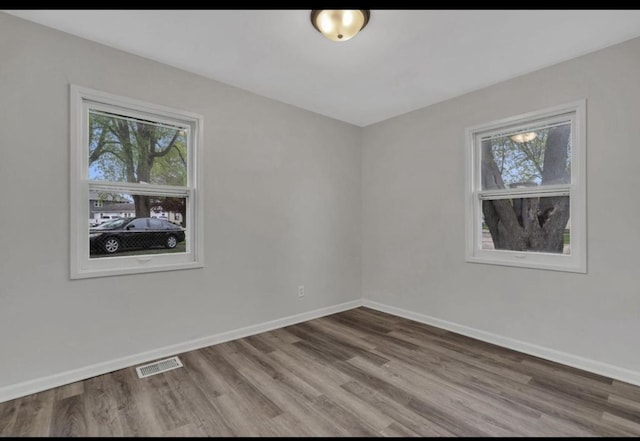 empty room featuring hardwood / wood-style floors