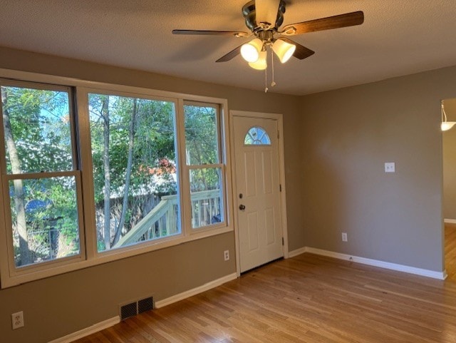 foyer featuring light hardwood / wood-style floors and ceiling fan