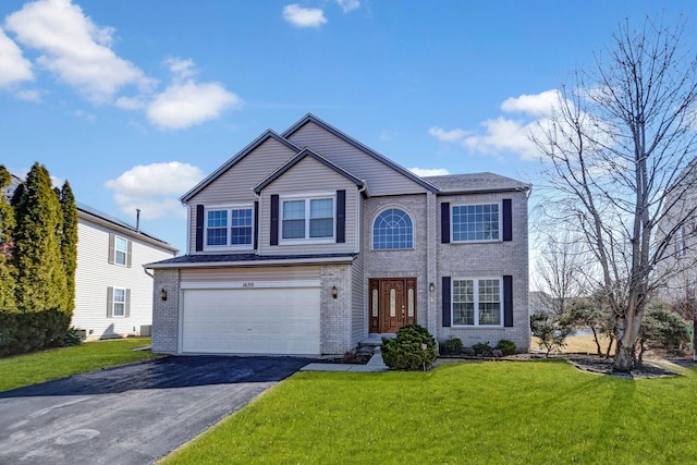 traditional home featuring brick siding, driveway, an attached garage, and a front lawn