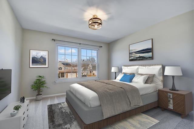 carpeted bedroom with baseboards