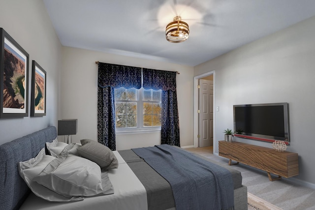 bedroom featuring baseboards and carpet flooring