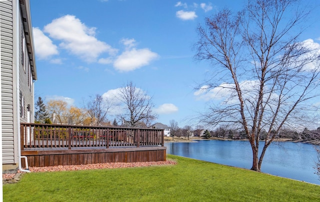 view of yard with a deck with water view