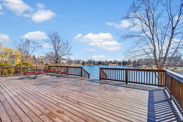 wooden terrace with a water view