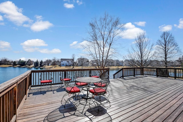 wooden deck with a water view