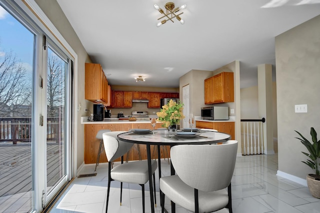 dining room featuring baseboards