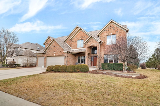 view of front of home with a garage and a front lawn