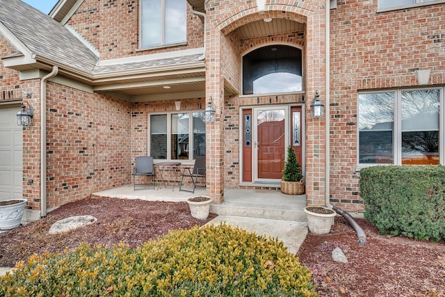 view of exterior entry featuring a garage