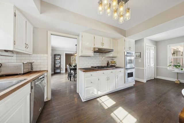 kitchen featuring stainless steel appliances, white cabinets, wooden counters, and under cabinet range hood