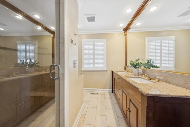 bathroom featuring crown molding, a stall shower, visible vents, and a sink