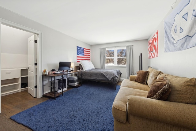 bedroom featuring dark wood finished floors