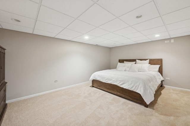 bedroom with recessed lighting, light carpet, a drop ceiling, and baseboards