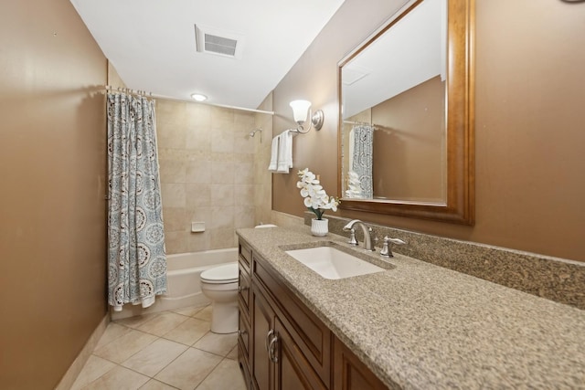 bathroom featuring shower / tub combo with curtain, visible vents, toilet, vanity, and tile patterned flooring