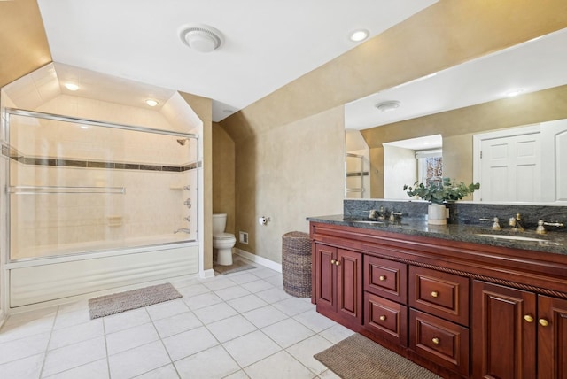 full bath featuring tile patterned floors, a sink, toilet, and double vanity