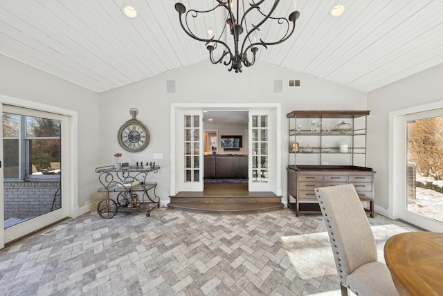 dining space with vaulted ceiling, brick floor, plenty of natural light, and visible vents