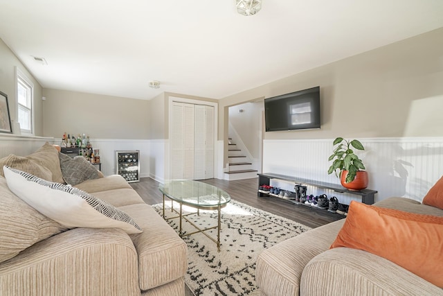 living room with hardwood / wood-style flooring and beverage cooler