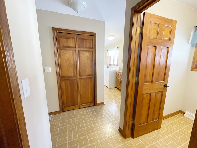 corridor with washer / clothes dryer