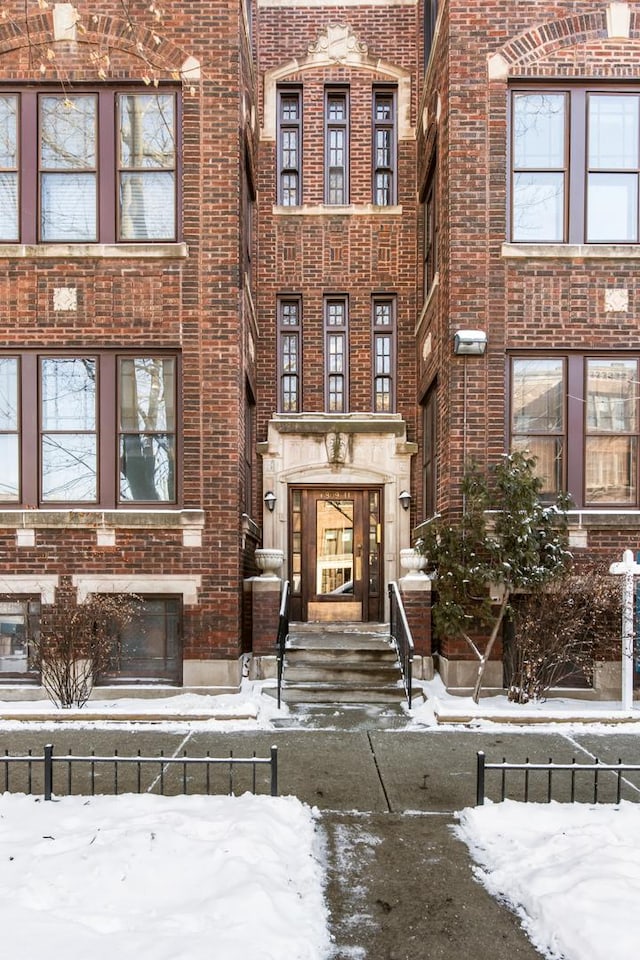 view of front of property featuring brick siding