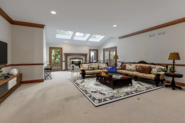 carpeted living room with lofted ceiling, crown molding, plenty of natural light, and a fireplace