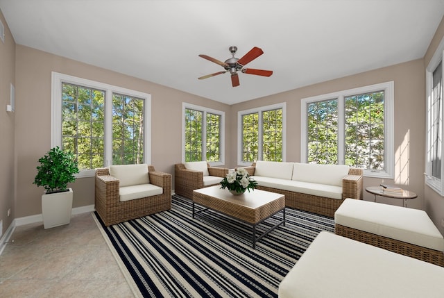 sunroom featuring ceiling fan