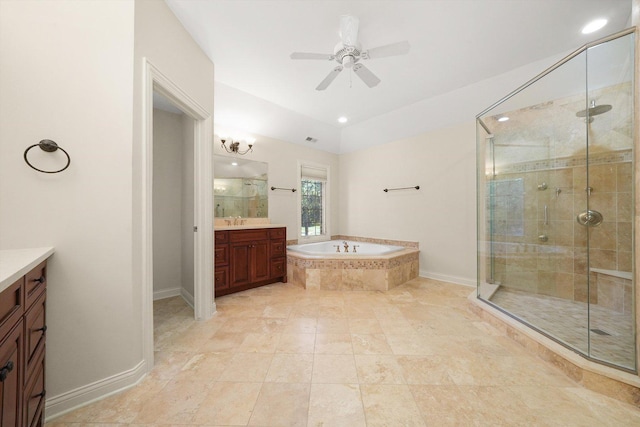 bathroom featuring ceiling fan, independent shower and bath, and vanity