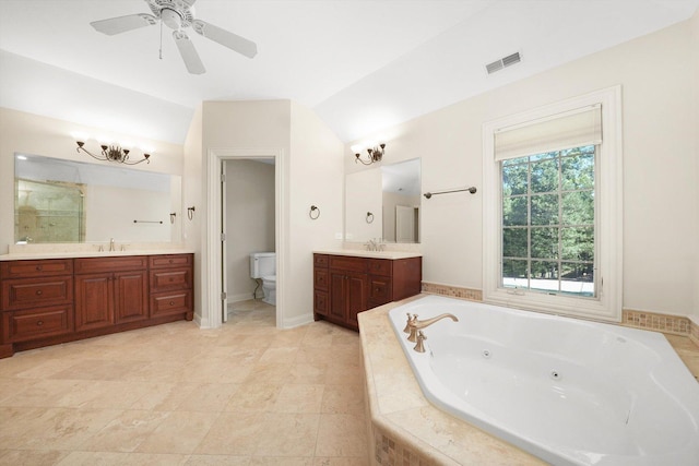 full bathroom with plus walk in shower, ceiling fan, vanity, and toilet