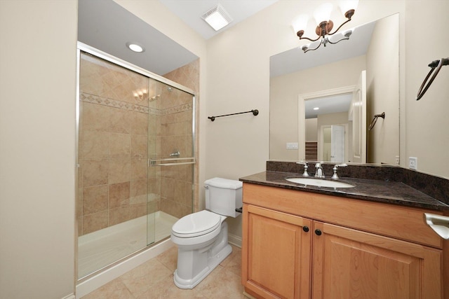 bathroom featuring an inviting chandelier, vanity, an enclosed shower, toilet, and tile patterned floors