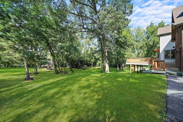 view of yard with a wooden deck