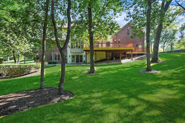 back of house with a lawn and a deck