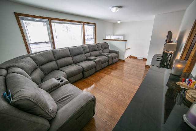 living room featuring light wood-style floors and baseboards