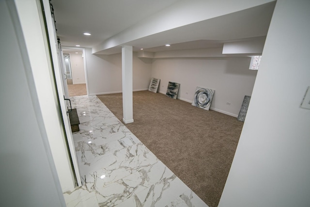 finished basement featuring carpet, baseboards, and recessed lighting