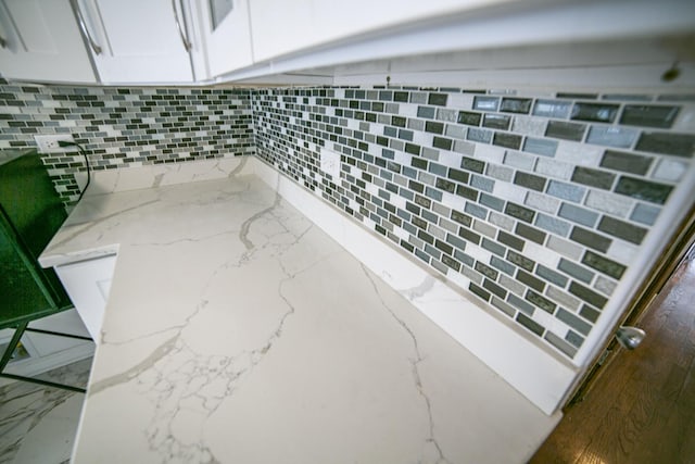 room details with light stone counters and white cabinets