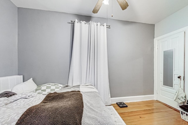 bedroom featuring ceiling fan and wood-type flooring