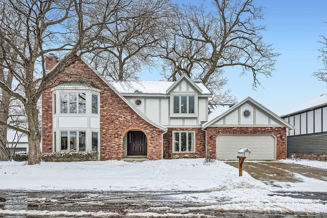 tudor home featuring a garage