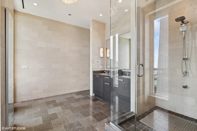 full bathroom featuring a shower stall, vanity, and recessed lighting