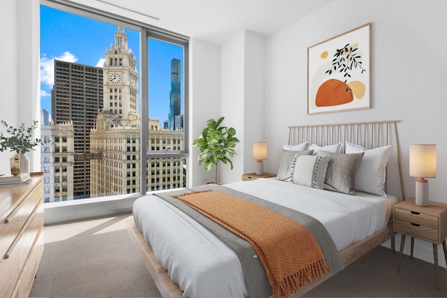 bedroom with carpet floors and expansive windows