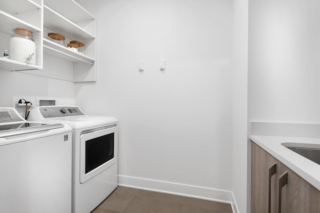 laundry area with independent washer and dryer