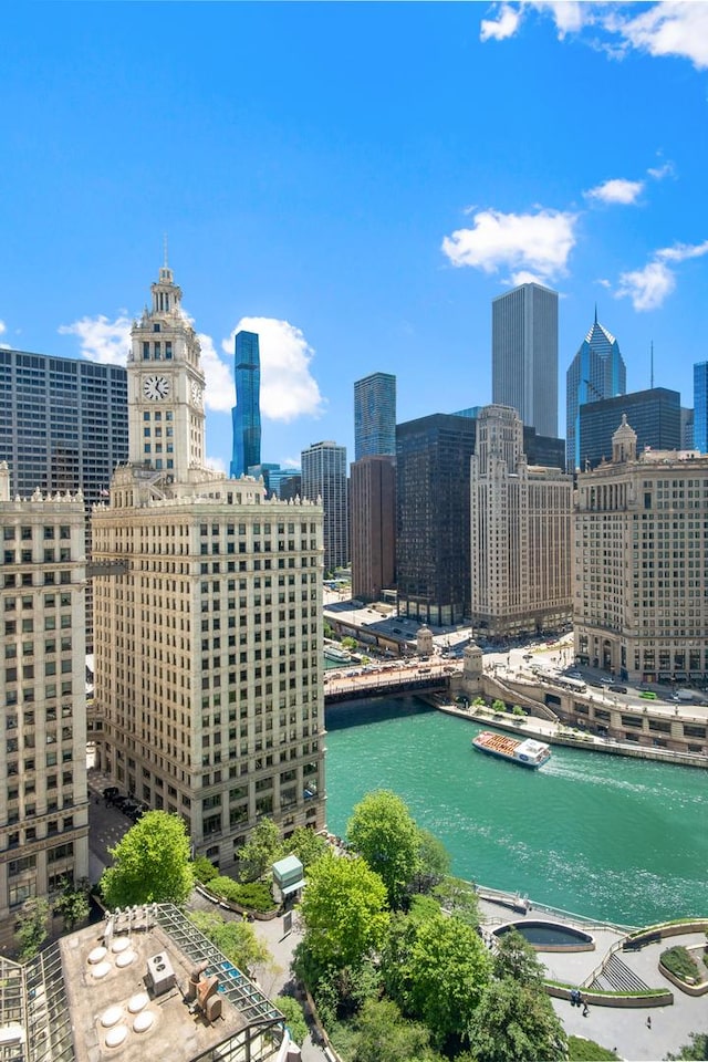 property's view of city featuring a water view