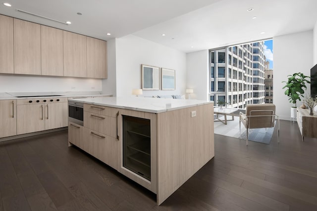 kitchen featuring floor to ceiling windows, dark hardwood / wood-style flooring, a kitchen island, wine cooler, and light brown cabinetry