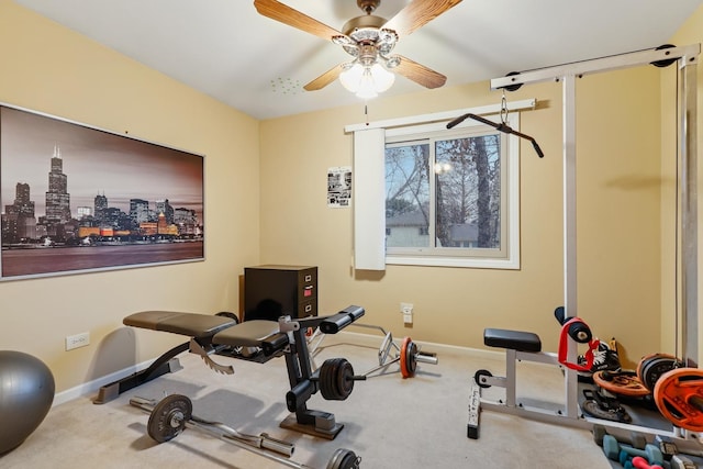 workout area with carpet floors, ceiling fan, and baseboards