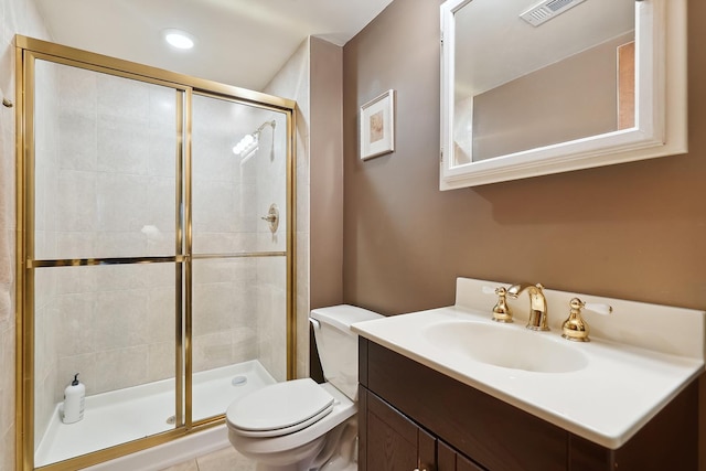 full bathroom with toilet, vanity, a shower stall, and visible vents