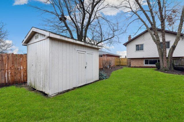 view of shed featuring a fenced backyard