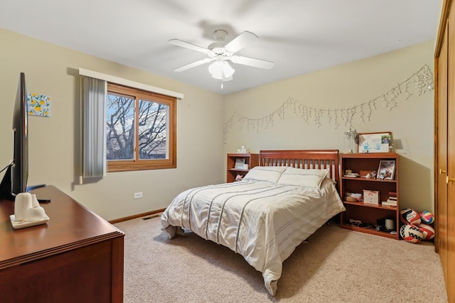 bedroom featuring carpet, visible vents, baseboards, and ceiling fan