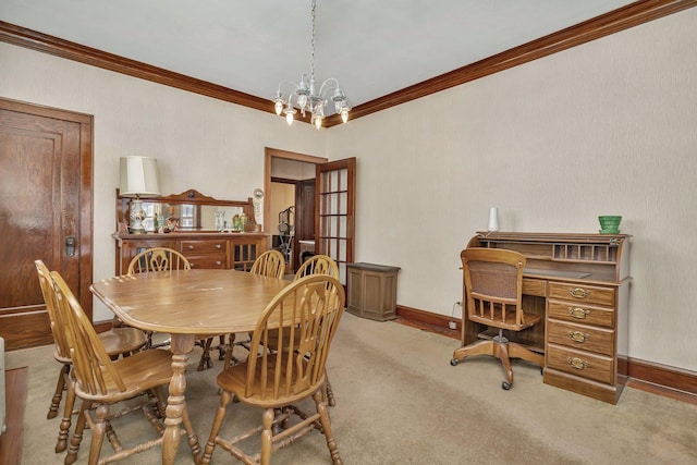 carpeted dining area featuring baseboards, an inviting chandelier, and crown molding