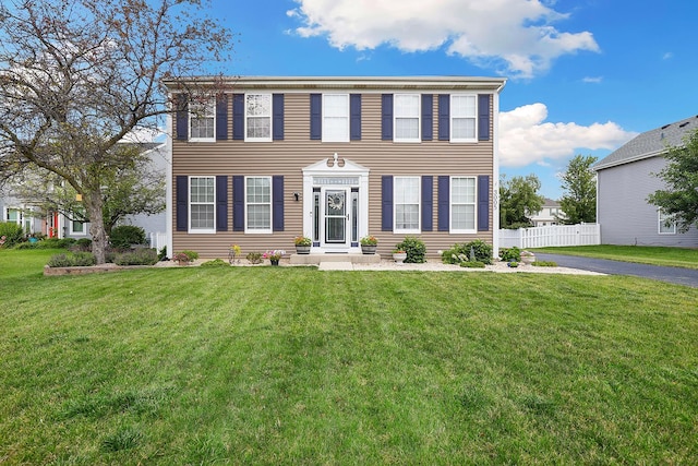 colonial inspired home with a front yard