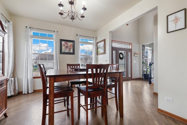 dining room with a notable chandelier and hardwood / wood-style floors